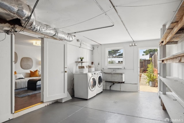 laundry area with sink and independent washer and dryer