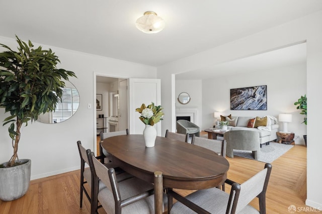 dining area with light wood-type flooring