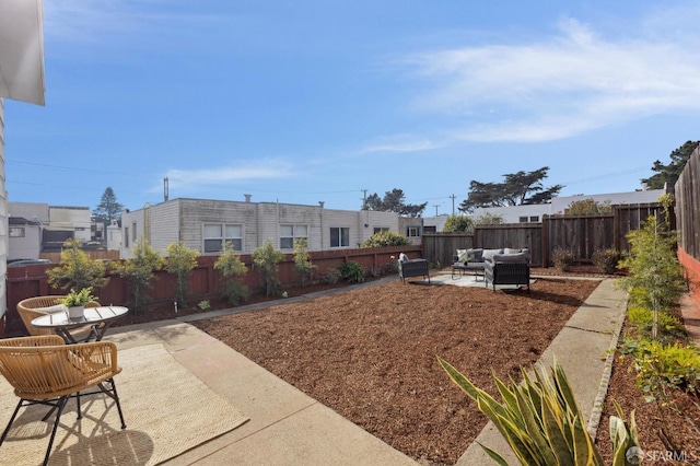 view of yard featuring an outdoor living space and a patio area