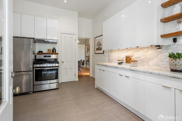 69 Pond St, San Francisco, CA 94114 - kitchen featuring appliances with stainless steel finishes, open shelves, under cabinet range hood, white cabinets, and tasteful backsplash