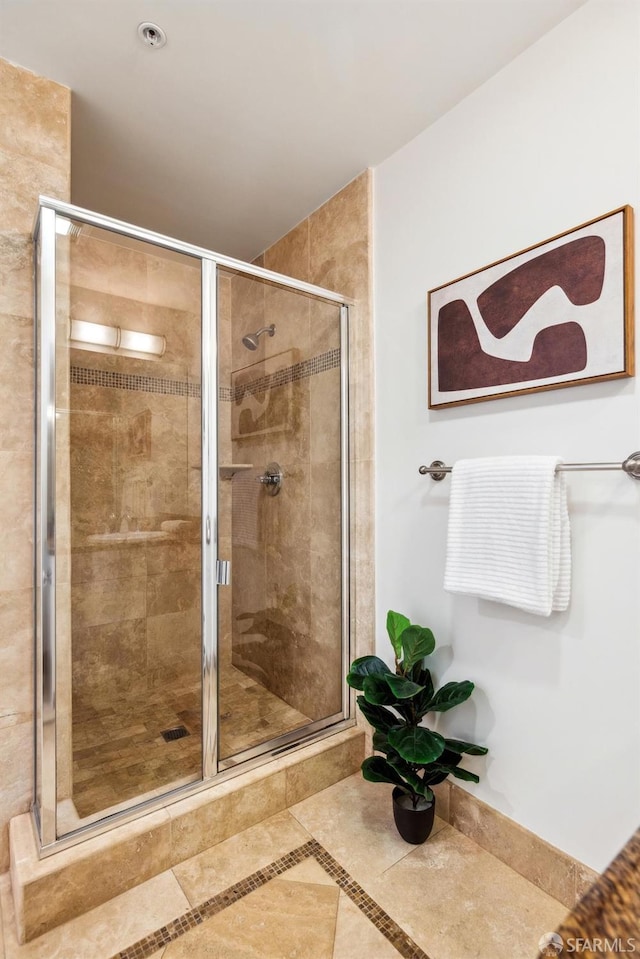 full bathroom with a shower stall