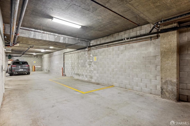 parking deck featuring concrete block wall