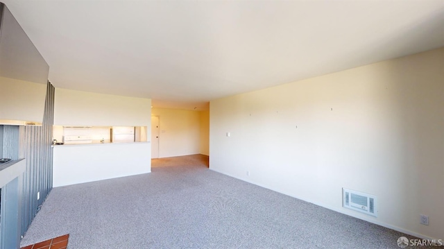 unfurnished living room with carpet flooring