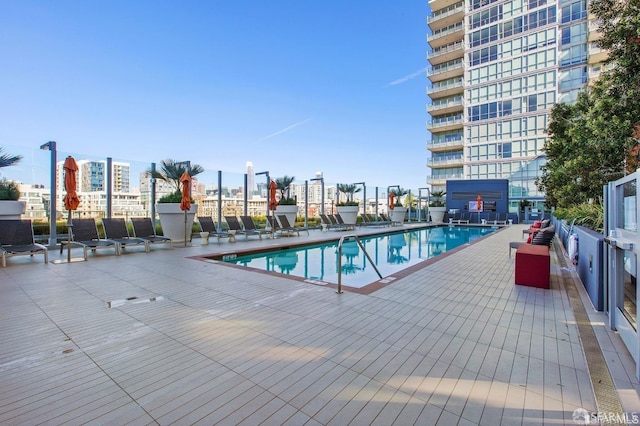 view of swimming pool with a patio