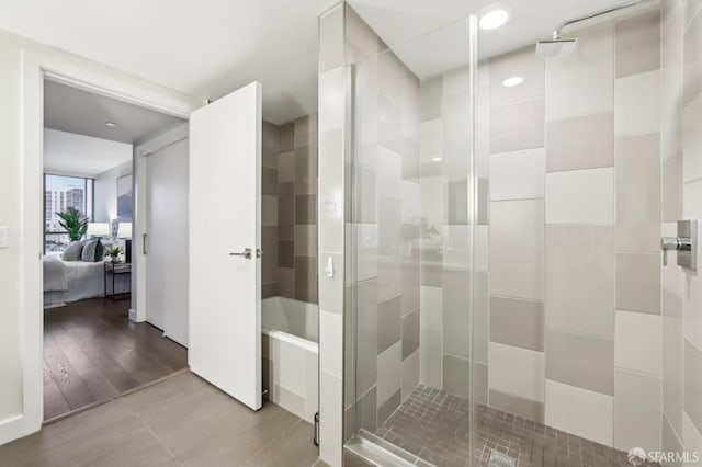 bathroom with a shower with shower door