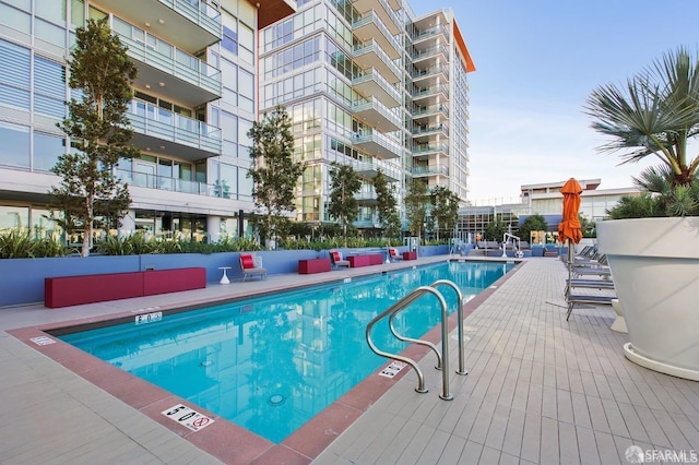 view of swimming pool featuring a patio