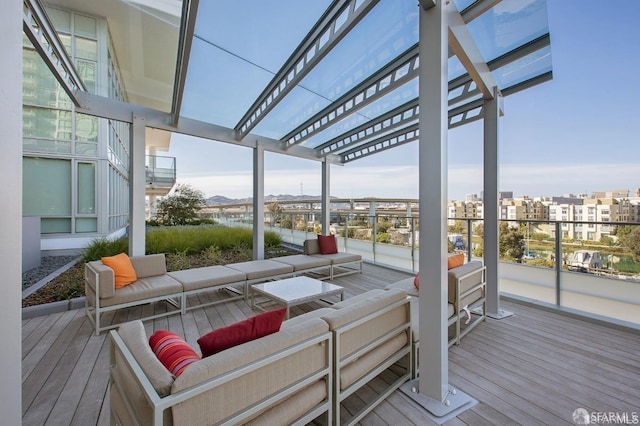 deck featuring an outdoor hangout area and a pergola