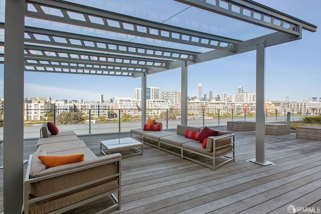 wooden terrace featuring outdoor lounge area and a pergola