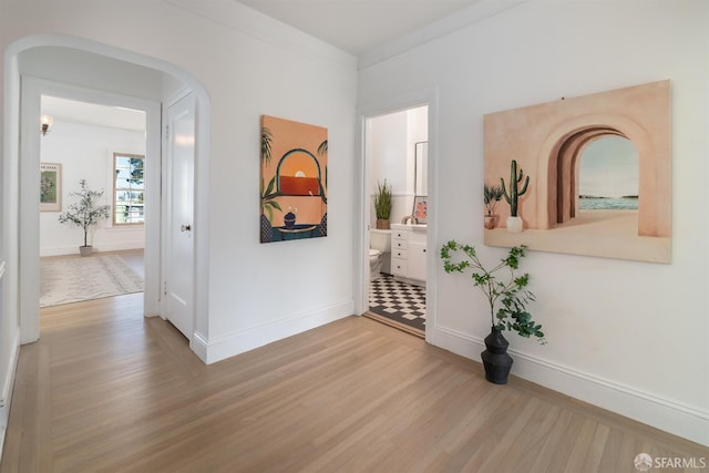 651 29th Ave, San Francisco, CA 94121 - hall with wood finished floors, baseboards, and arched walkways