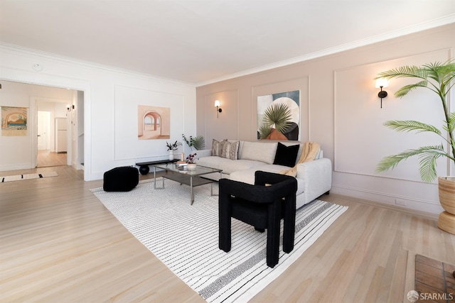 651 29th Ave, San Francisco, CA 94121 - living room featuring light wood finished floors, ornamental molding, a decorative wall, and baseboards