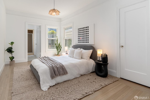 651 29th Ave, San Francisco, CA 94121 - bedroom with wood finished floors, baseboards, and connected bathroom