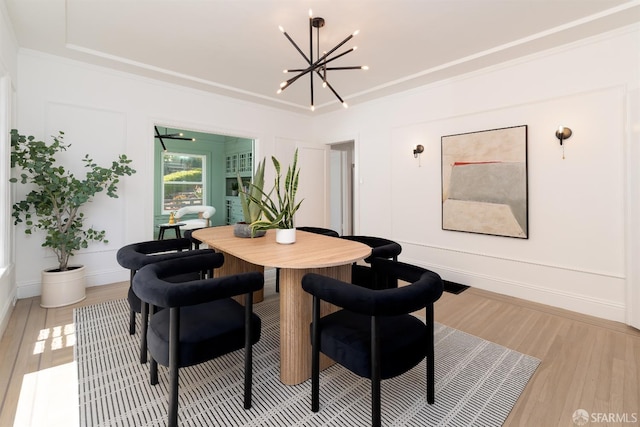 651 29th Ave, San Francisco, CA 94121 - dining room with a chandelier, light wood-style flooring, and crown molding