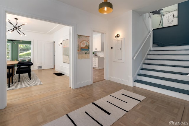 651 29th Ave, San Francisco, CA 94121 - foyer featuring a chandelier, stairs, baseboards, and electric panel