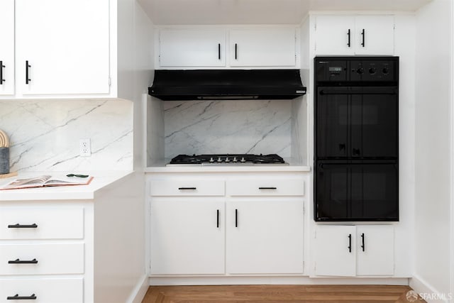 651 29th Ave, San Francisco, CA 94121 - kitchen with range hood, gas cooktop, light countertops, decorative backsplash, and white cabinets