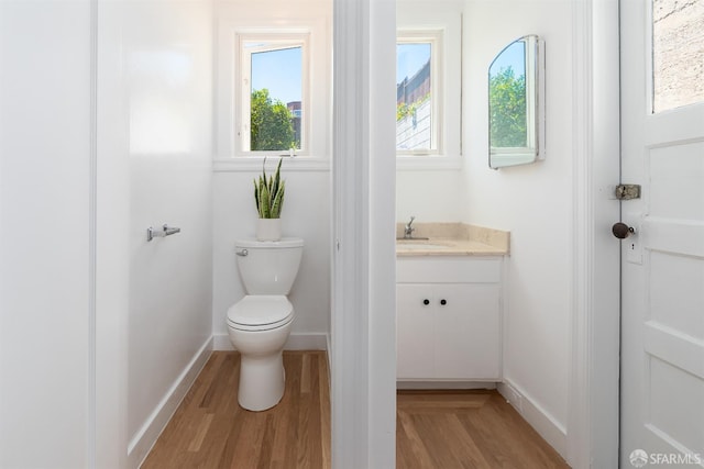 651 29th Ave, San Francisco, CA 94121 - bathroom with wood finished floors, vanity, toilet, and baseboards