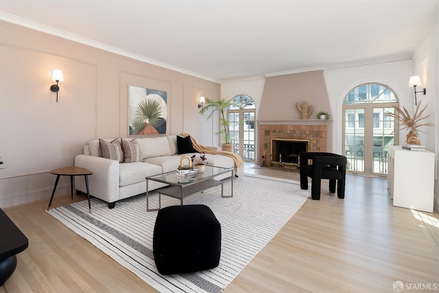 651 29th Ave, San Francisco, CA 94121 - living area featuring crown molding, light wood-style flooring, and a fireplace