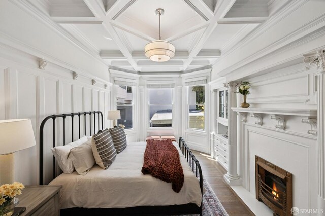2427 Franklin St, San Francisco, CA 94123 - bedroom featuring wood finished floors, coffered ceiling, beam ceiling, a premium fireplace, and a decorative wall