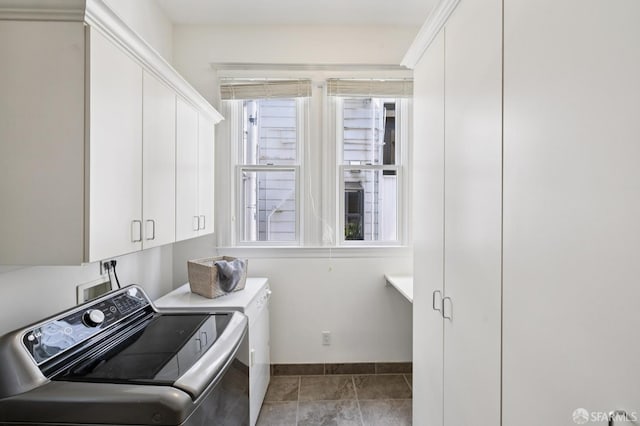 2427 Franklin St, San Francisco, CA 94123 - washroom with washer and dryer, cabinet space, and tile patterned flooring