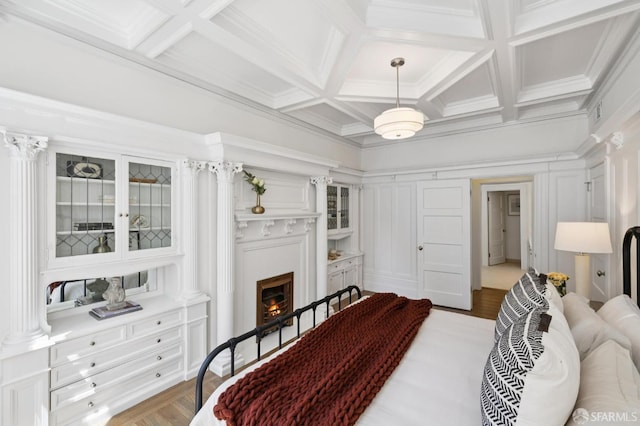 2427 Franklin St, San Francisco, CA 94123 - bedroom featuring a lit fireplace, coffered ceiling, wood finished floors, beamed ceiling, and crown molding