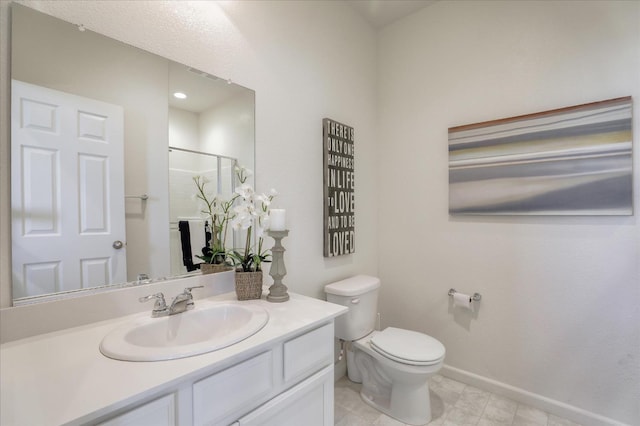 21051 Pinot Noir Dr, Patterson, CA 95363 - full bath with a stall shower, toilet, vanity, and baseboards