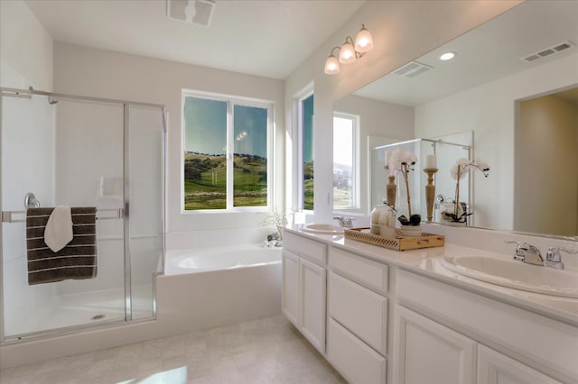 21051 Pinot Noir Dr, Patterson, CA 95363 - bathroom featuring a stall shower, double vanity, and a garden tub