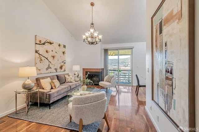 349 Philip Dr Unit 304, Daly City, CA 94015 - living area featuring a fireplace, high vaulted ceiling, a chandelier, baseboards, and wood finished floors