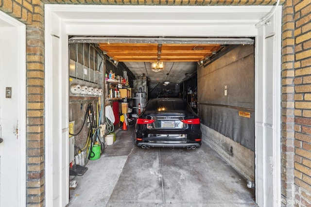 1915 Laguna St Unit 4, San Francisco, CA 94115 - garage featuring strapped water heater and a garage door opener