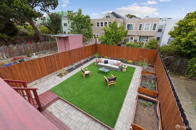 57 Theresa St, San Francisco, CA 94112 - fenced backyard with an outdoor hangout area, a vegetable garden, and a patio