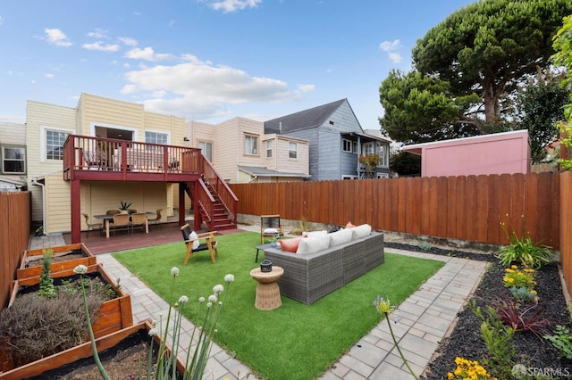 57 Theresa St, San Francisco, CA 94112 - fenced backyard with a wooden deck, a garden, outdoor lounge area, stairs, and a residential view