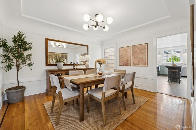 57 Theresa St, San Francisco, CA 94112 - dining space with a chandelier, light wood-type flooring, and a raised ceiling