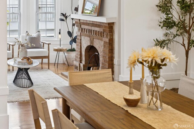 57 Theresa St, San Francisco, CA 94112 - living area featuring a brick fireplace and wood finished floors