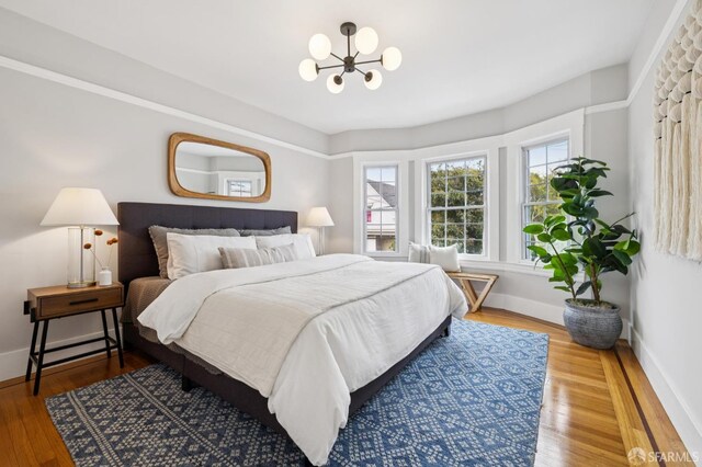 57 Theresa St, San Francisco, CA 94112 - bedroom with a chandelier and wood finished floors