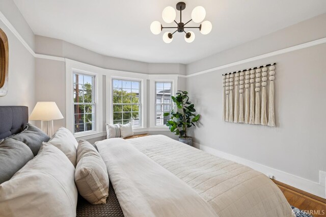 57 Theresa St, San Francisco, CA 94112 - bedroom featuring a chandelier and wood finished floors
