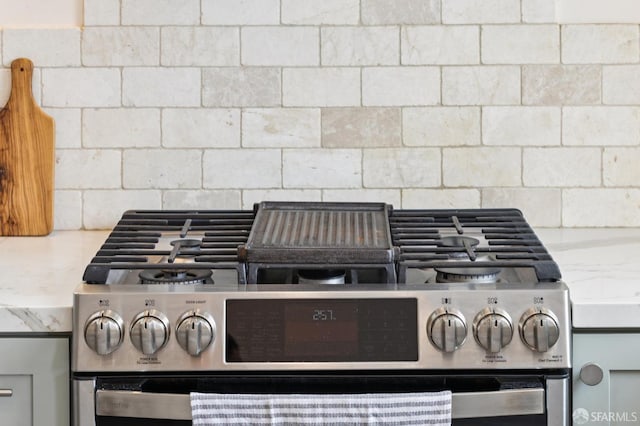 57 Theresa St, San Francisco, CA 94112 - detailed view of stainless steel gas range oven, backsplash, and light stone countertops