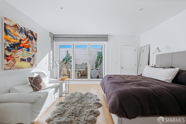 bedroom with hardwood / wood-style floors