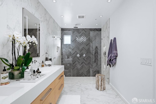 bathroom featuring vanity and a tile shower