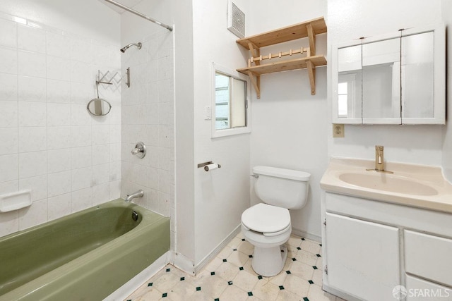 full bathroom with toilet, tiled shower / bath combo, and vanity