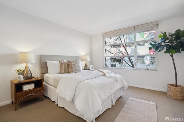 carpeted bedroom with baseboards