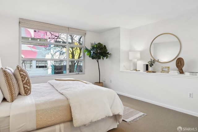 bedroom with carpet flooring and baseboards