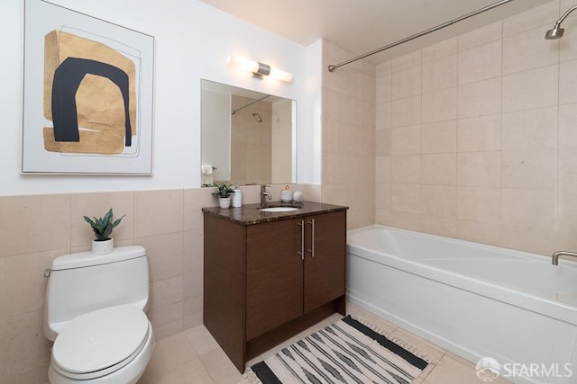 full bath featuring tile patterned flooring, toilet, tile walls, and washtub / shower combination