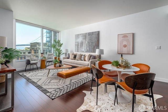 living room with baseboards and dark wood-type flooring