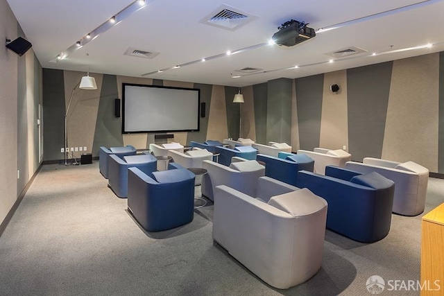 home theater with visible vents, light colored carpet, and baseboards