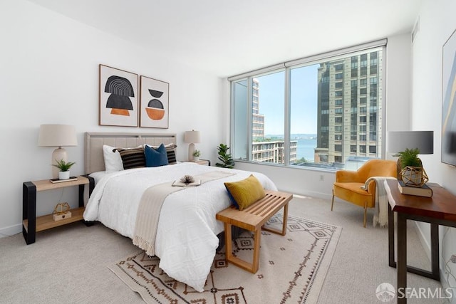 carpeted bedroom with baseboards