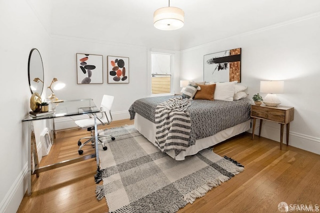 24 Magnolia St, San Francisco, CA 94123 - bedroom with light wood-style flooring, baseboards, and crown molding