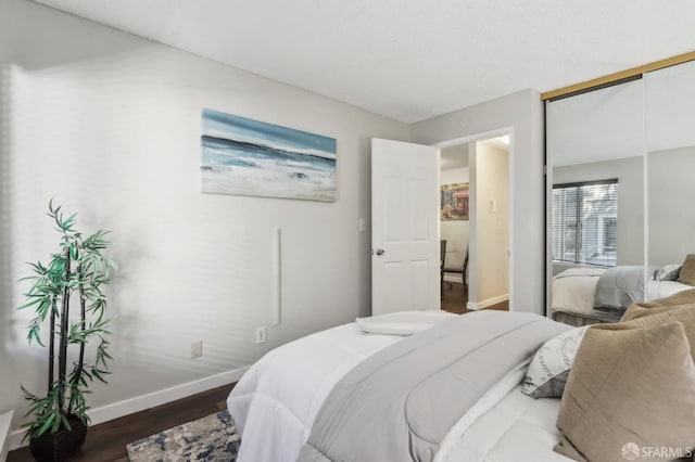 1140 Whipple Ave Unit 21, Redwood City, CA 94062 - bedroom with baseboards, dark wood-style floors, and a closet