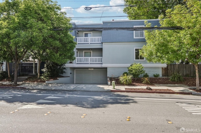 1140 Whipple Ave Unit 21, Redwood City, CA 94062 - view of front of house with driveway, a balcony, and a garage