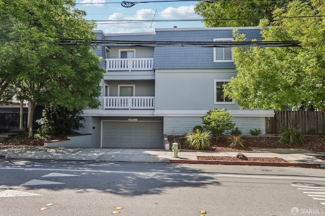 1140 Whipple Ave Unit 21, Redwood City, CA 94062 - front facade featuring concrete driveway, a balcony, and a garage