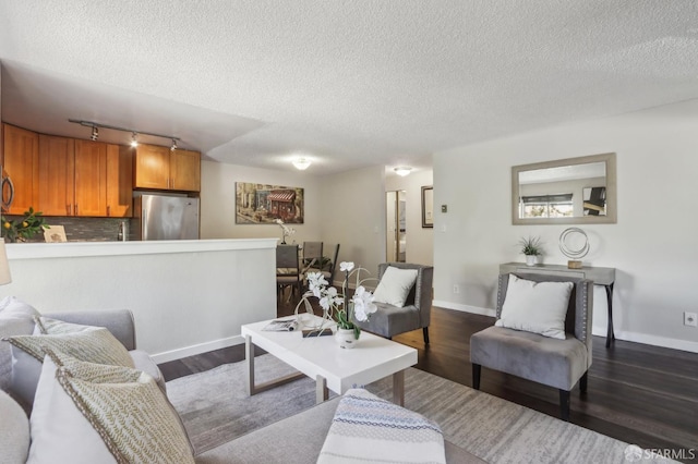 1140 Whipple Ave Unit 21, Redwood City, CA 94062 - living area with a textured ceiling, dark wood-style floors, baseboards, and track lighting