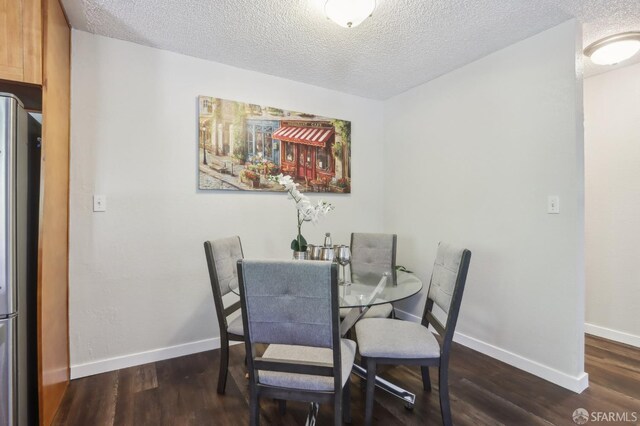 1140 Whipple Ave Unit 21, Redwood City, CA 94062 - dining space featuring a textured ceiling, wood finished floors, and baseboards
