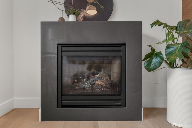 interior details with hardwood / wood-style flooring